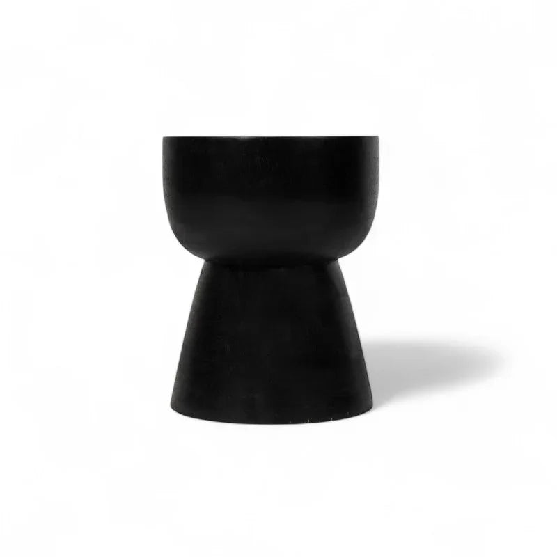 Handcrafted black wooden stool with modern hourglass shape from Kayu Living