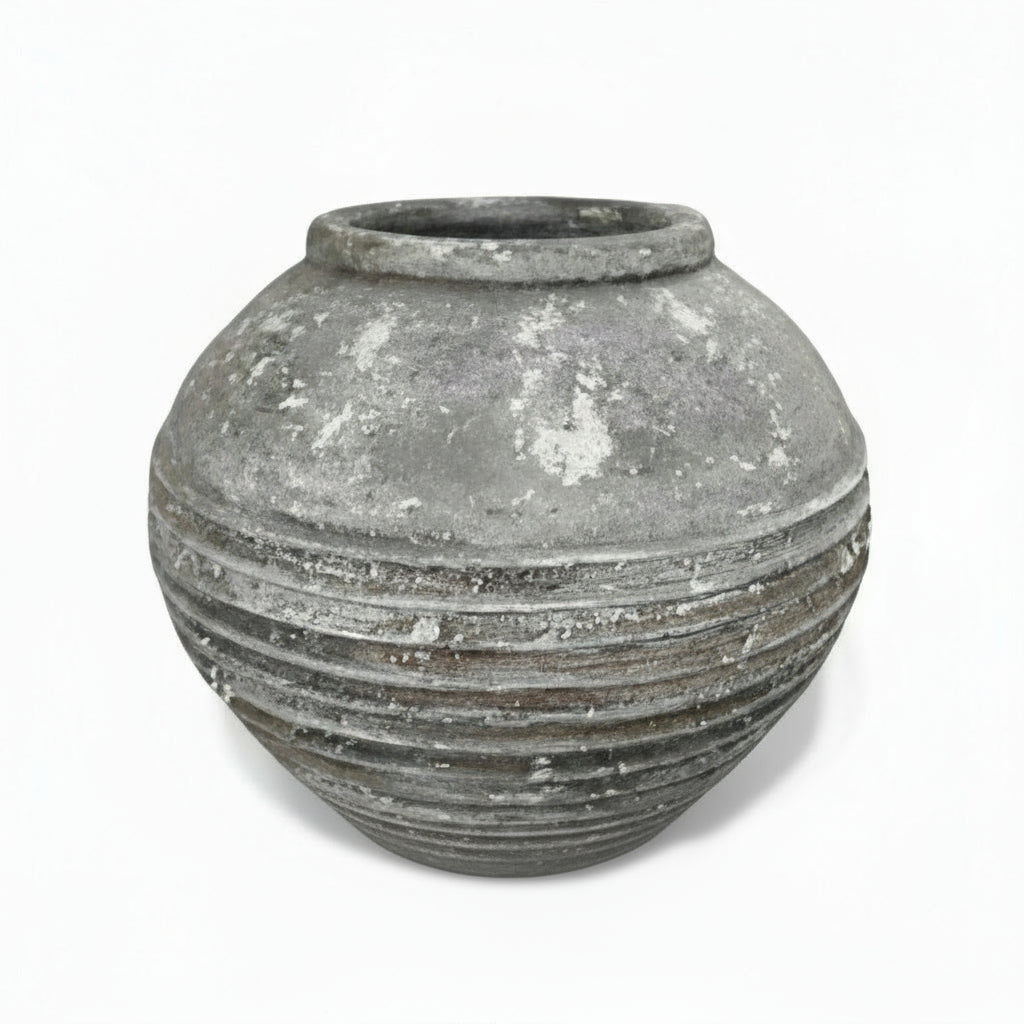 A vintage style terracotta pot with natural variations in texture and color, showing signs of aging and use, ideal for adding a rustic touch to any setting.