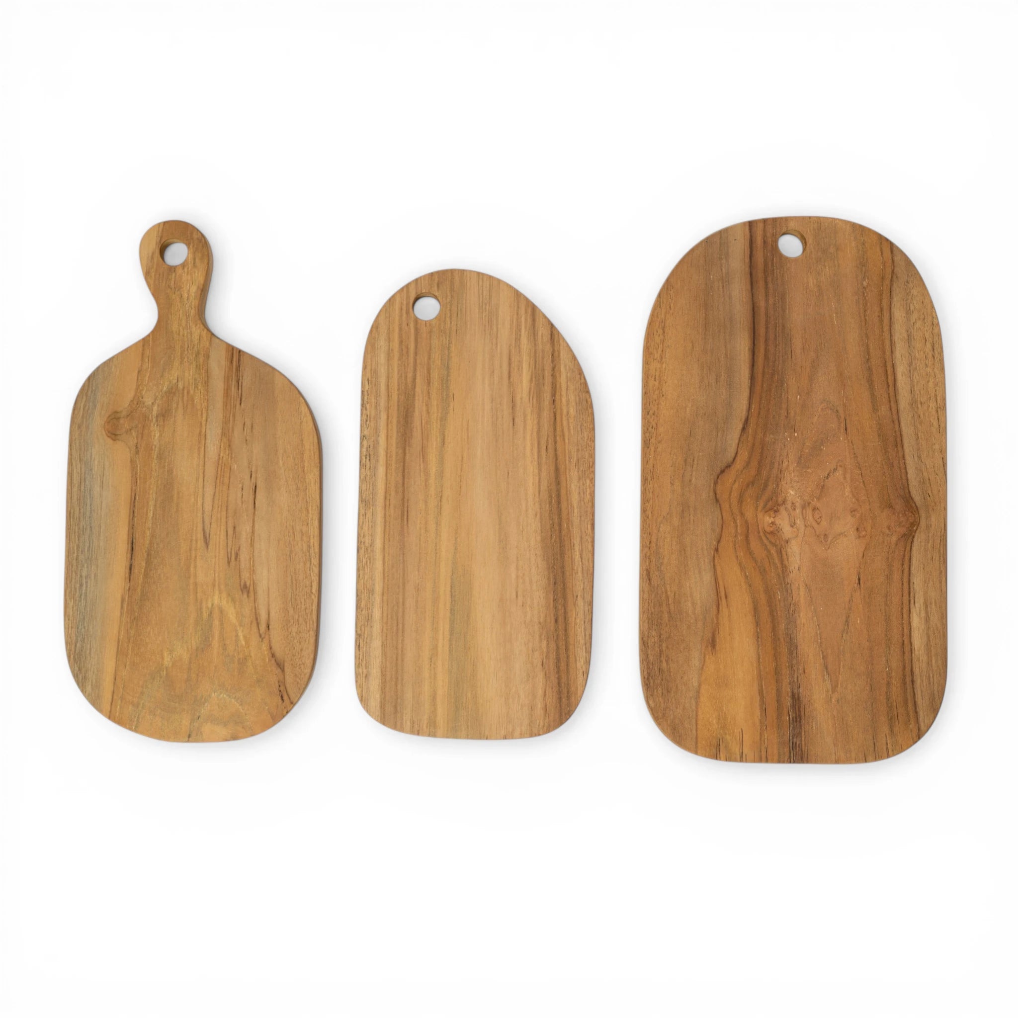 Teak cutting board from Kayu Living, rectangular shape with natural wood grain, ideal for chopping and serving.