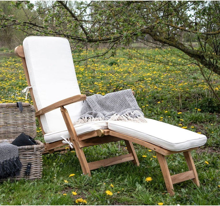 Kayu Living Arrecife natural teak deck chair with plush white cushion, adjustable reclining, outdoor furniture.