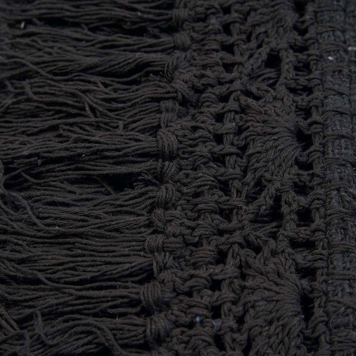 Kayu Living black cotton Gypsy bed throw featuring intricate macrame-style crochet texture and long fringe detail.