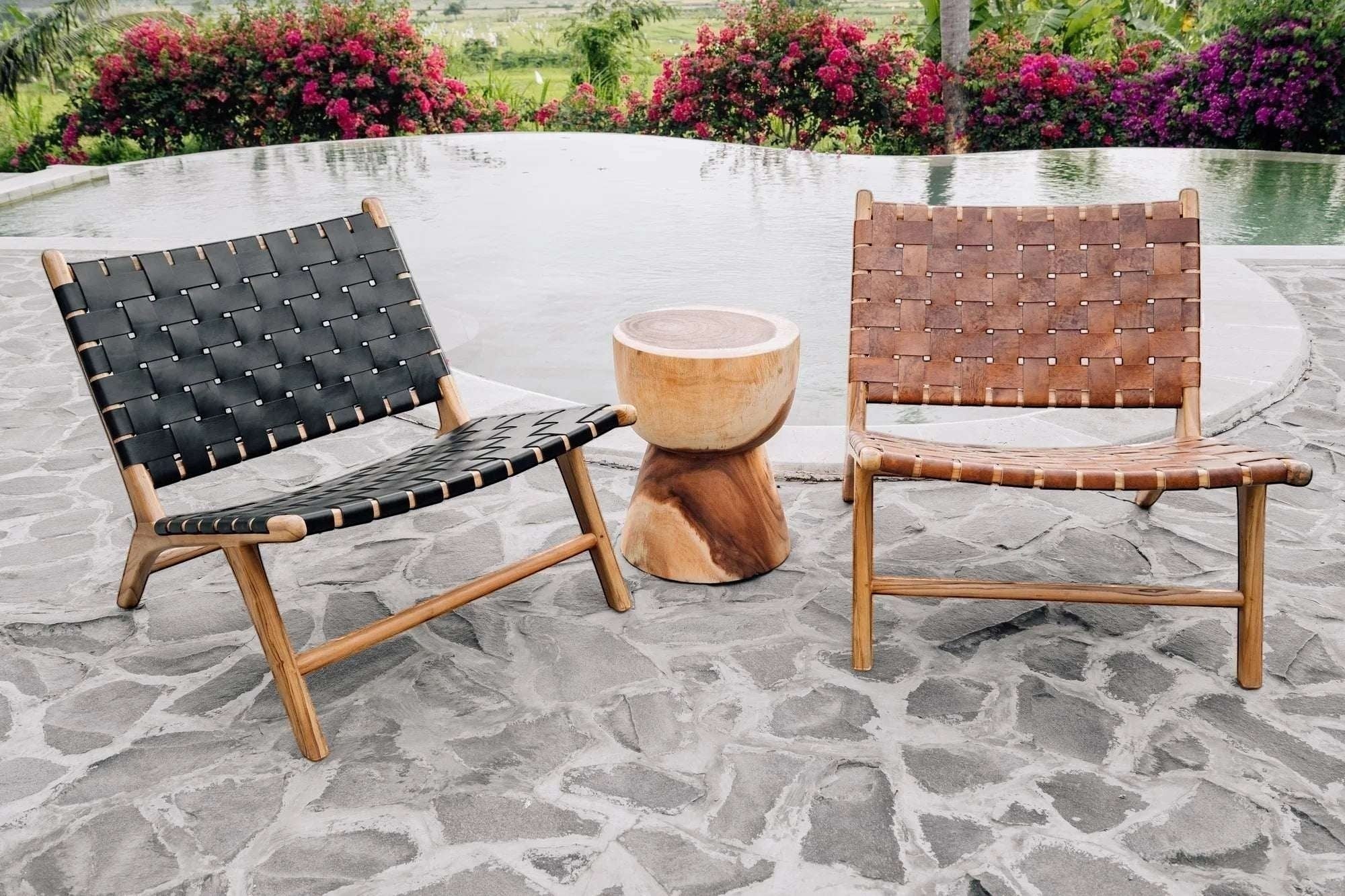 Kayu Living black handwoven leather lounge chair with teak frame, modern design, comfortable seating.