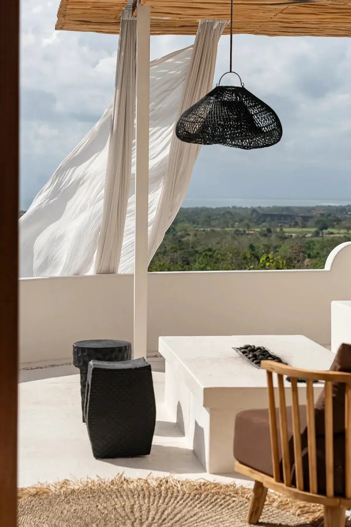 Kayu Living black rattan cloud pendant lamp, boho style, perfect for bedrooms or living spaces.