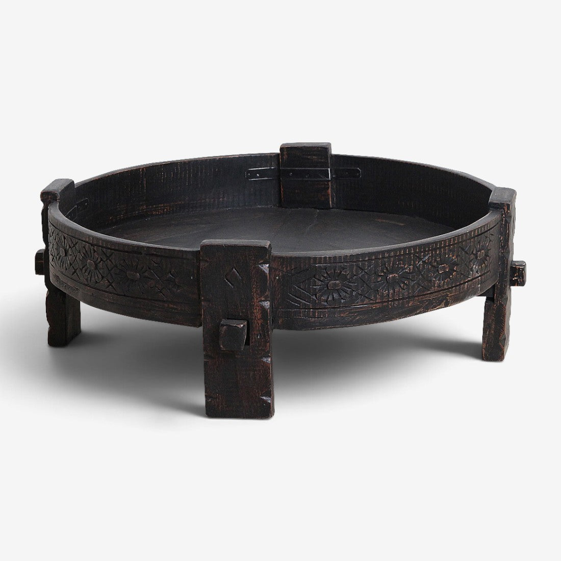 Kayu Living black hand-carved recycled wood Chakki side table with a low profile and intricate rim detailing.