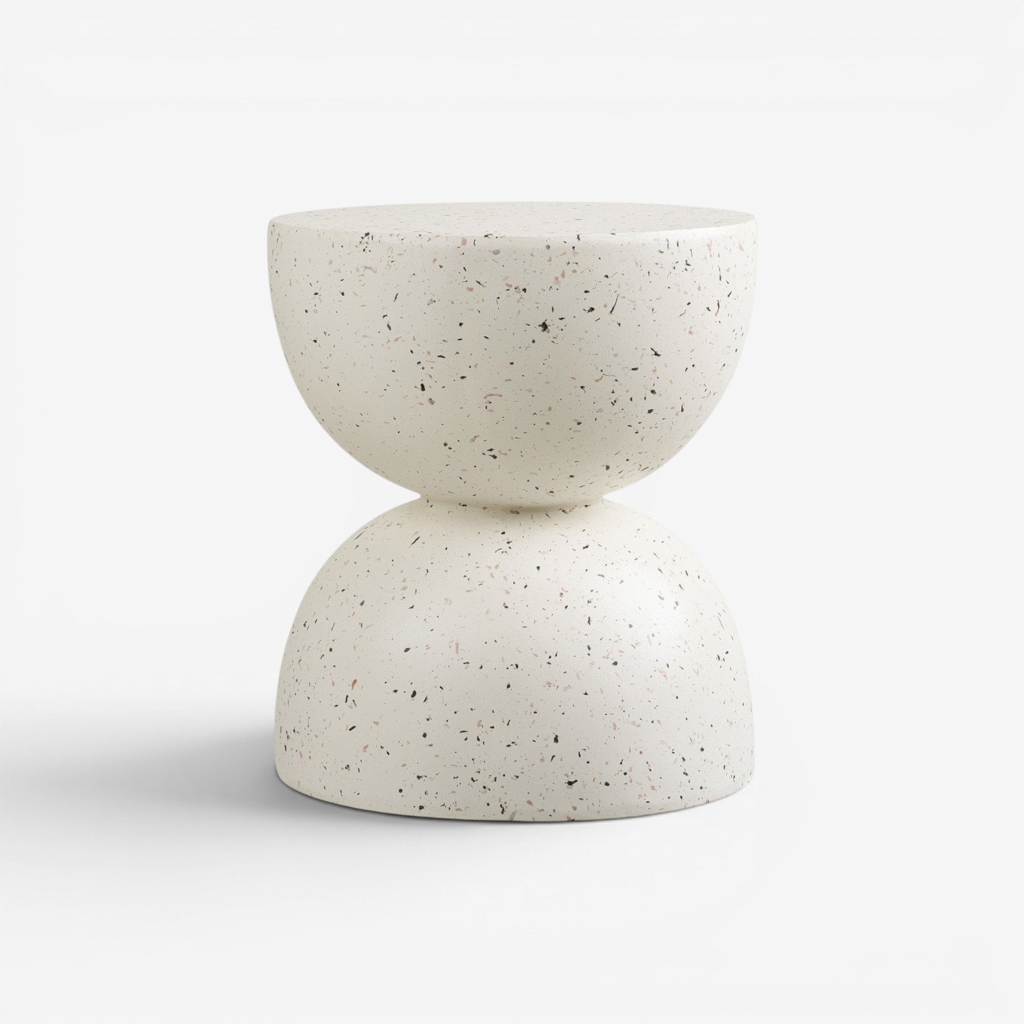 Kayu Living Bonita side table in off-white fiberclay with a speckled terrazzo finish and hourglass silhouette.