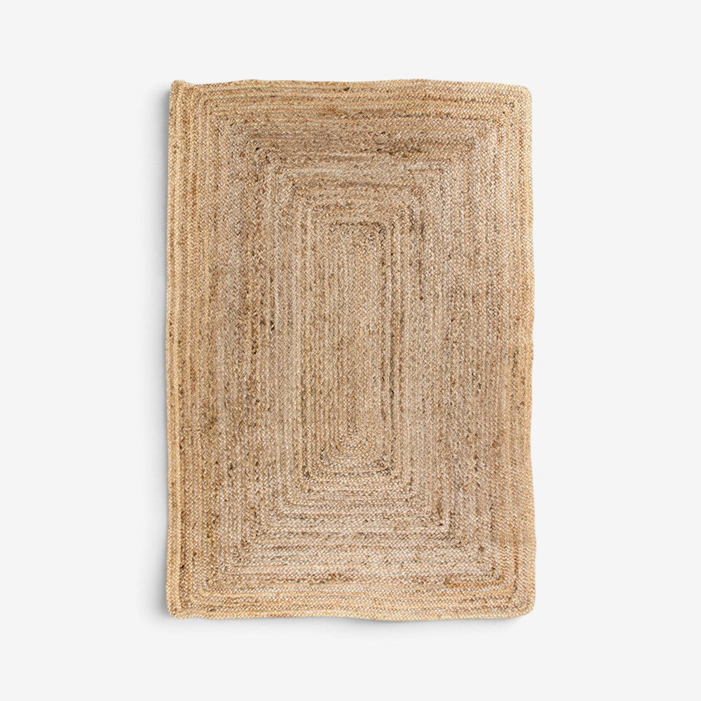 Kayu Living rectangular braided jute rug in natural tan, 60x90cm, featuring a durable eco-friendly woven texture.