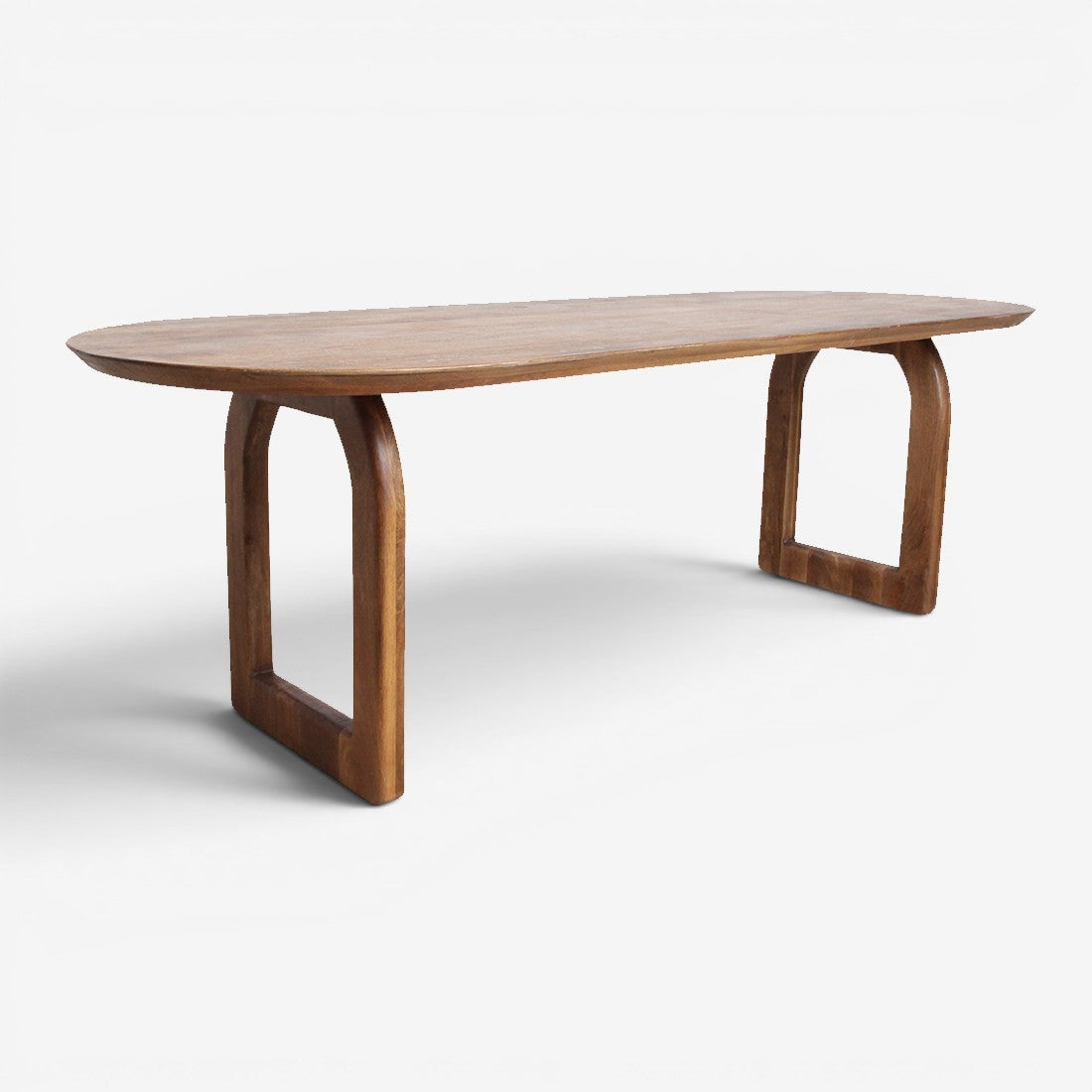 Kayu Living bullnose dining table in natural mango wood with a rounded oval top and unique open arch base design.