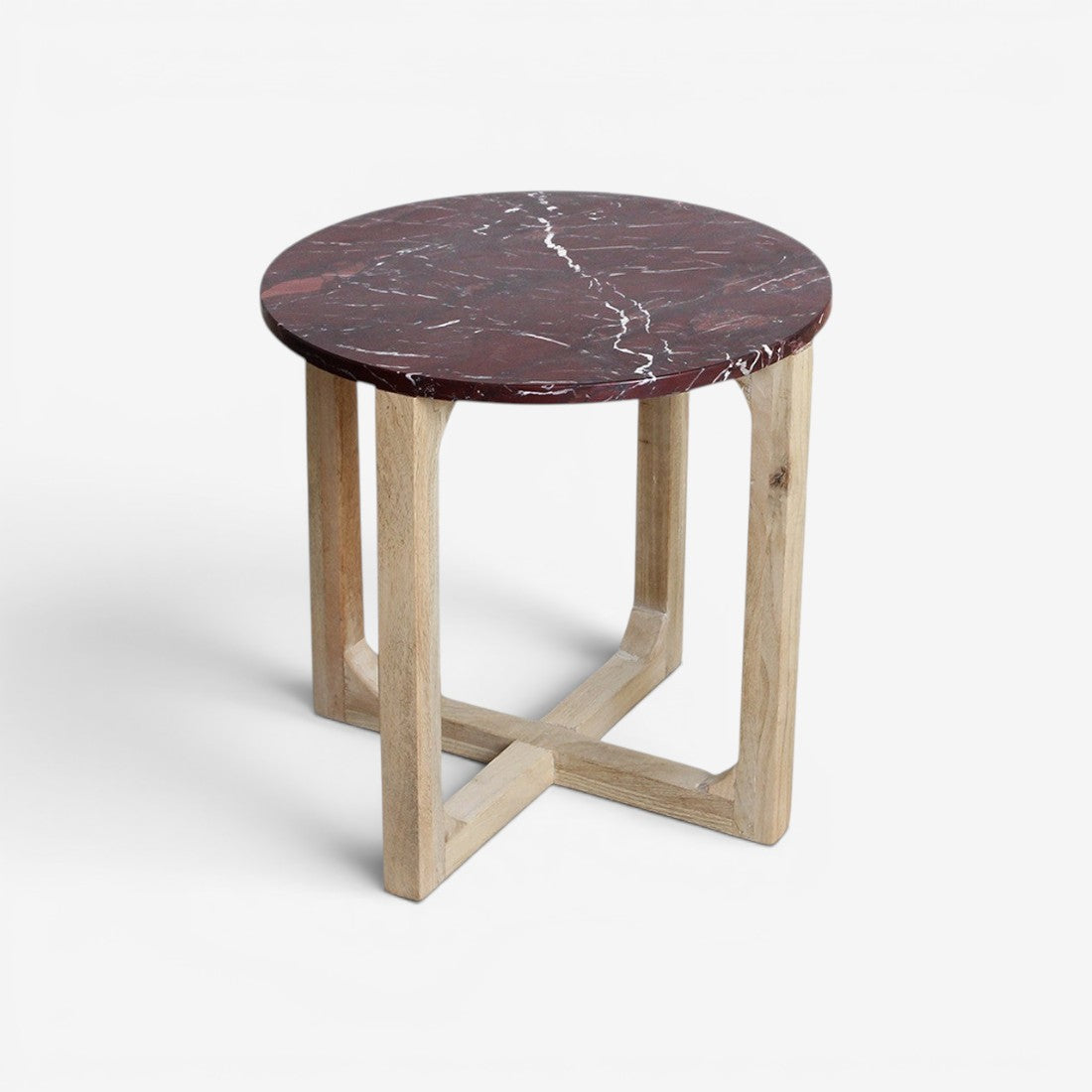 Kayu Living round side table with a burgundy marble top and natural mango wood cross-leg base.