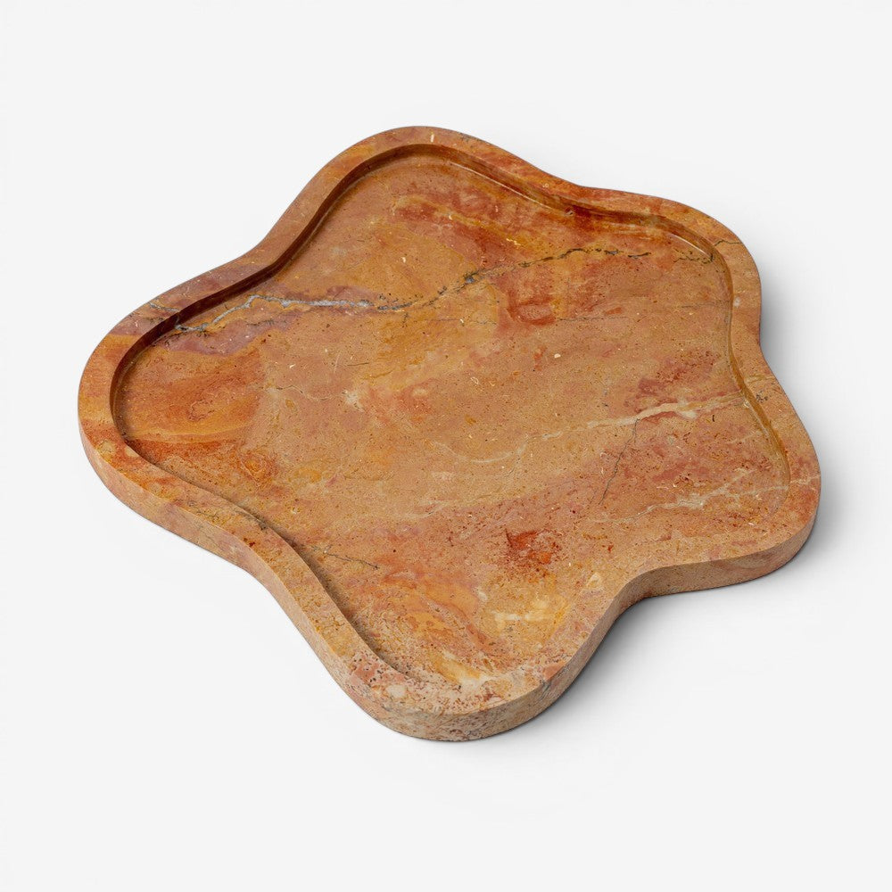 Kayu Living Flow Tray in caramel veined onyx stone with pink, ochre, and terracotta hues. Features a wavy edge.