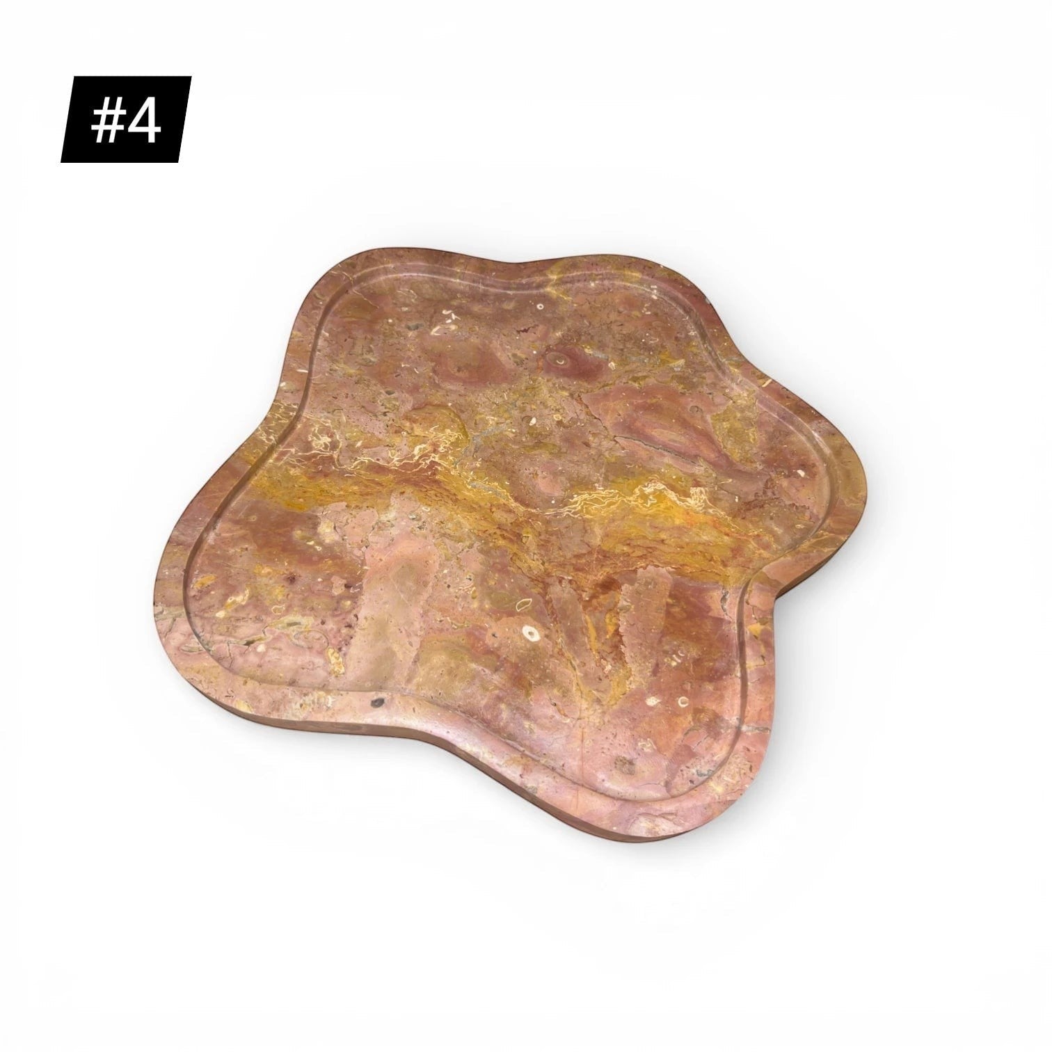 Kayu Living Flow Tray in caramel onyx stone with pink, ochre, and terracotta veining and a wavy edge.