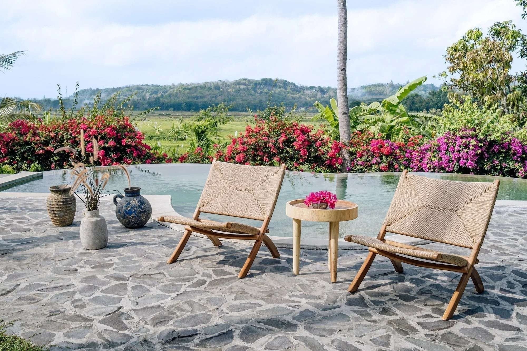 Kayu Living Cemagi foldable lounge chair with teak frame and handwoven natural rope seat, perfect for indoor/outdoor relaxation.