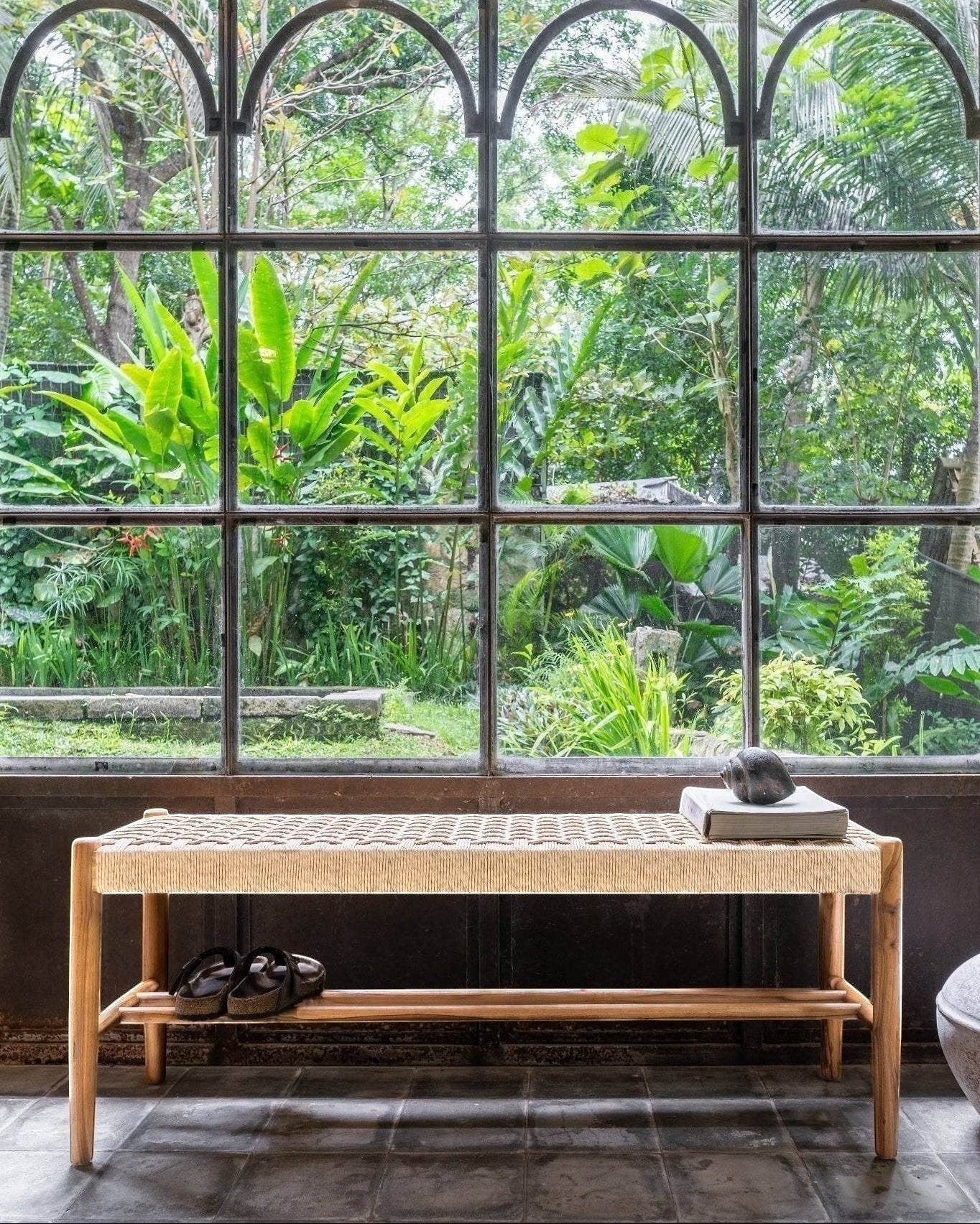 Kayu Living Cemagi 120 cm teak bench with handwoven rope seat and lower shelf. Natural wood and beige.