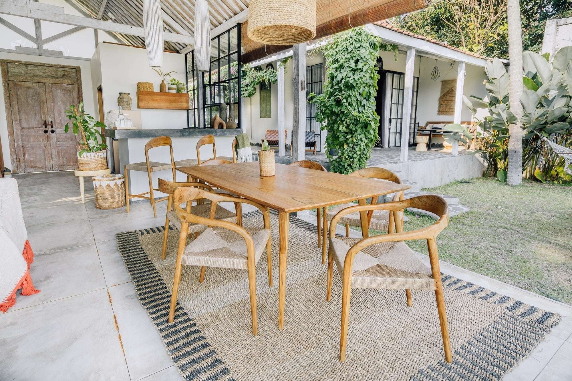 Kayu Living Cemagi chair with teak frame and handwoven rope seat, suitable for indoor/outdoor use.