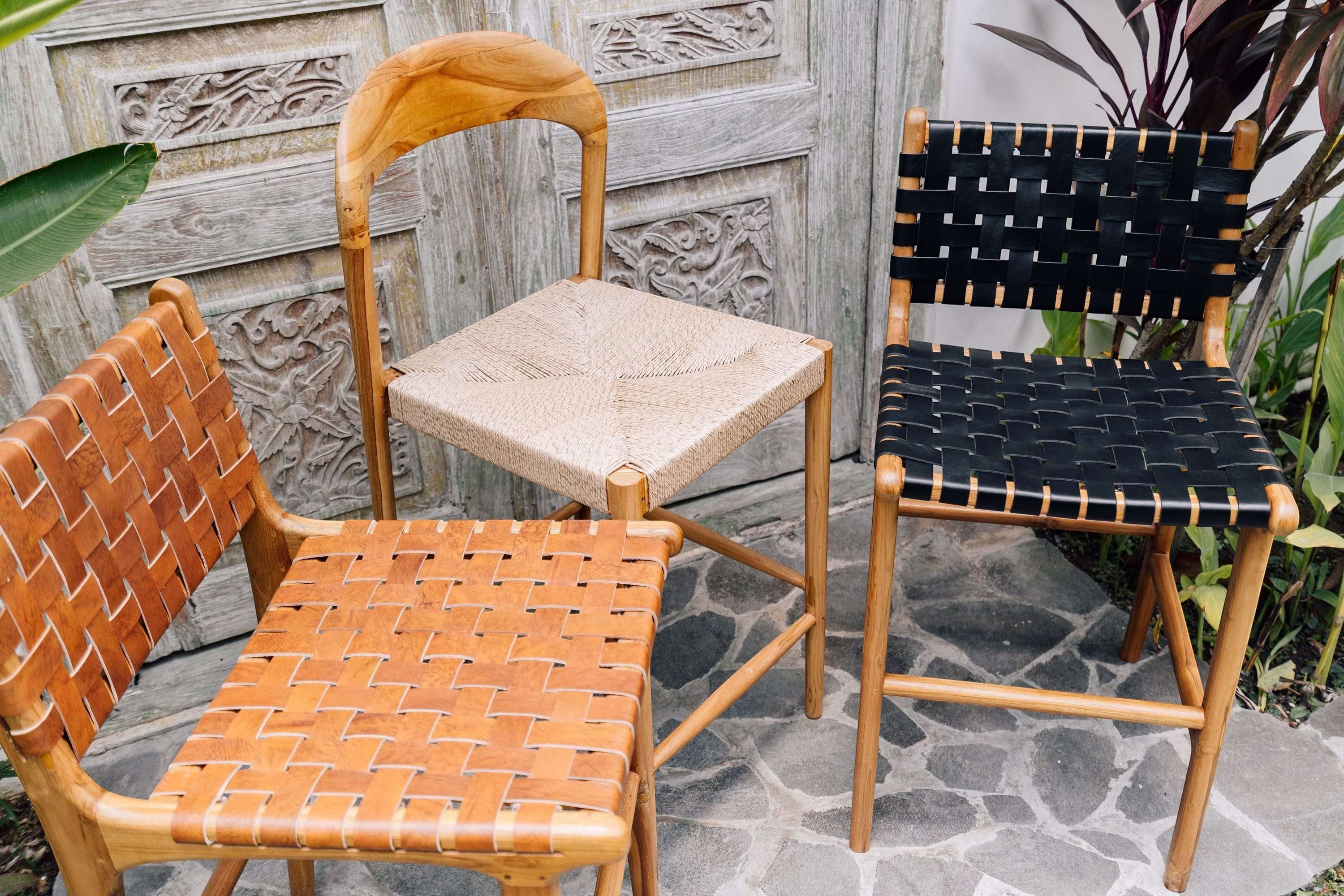 Kayu Living Cemagi teak counter stool with woven natural rope seat and curved backrest.