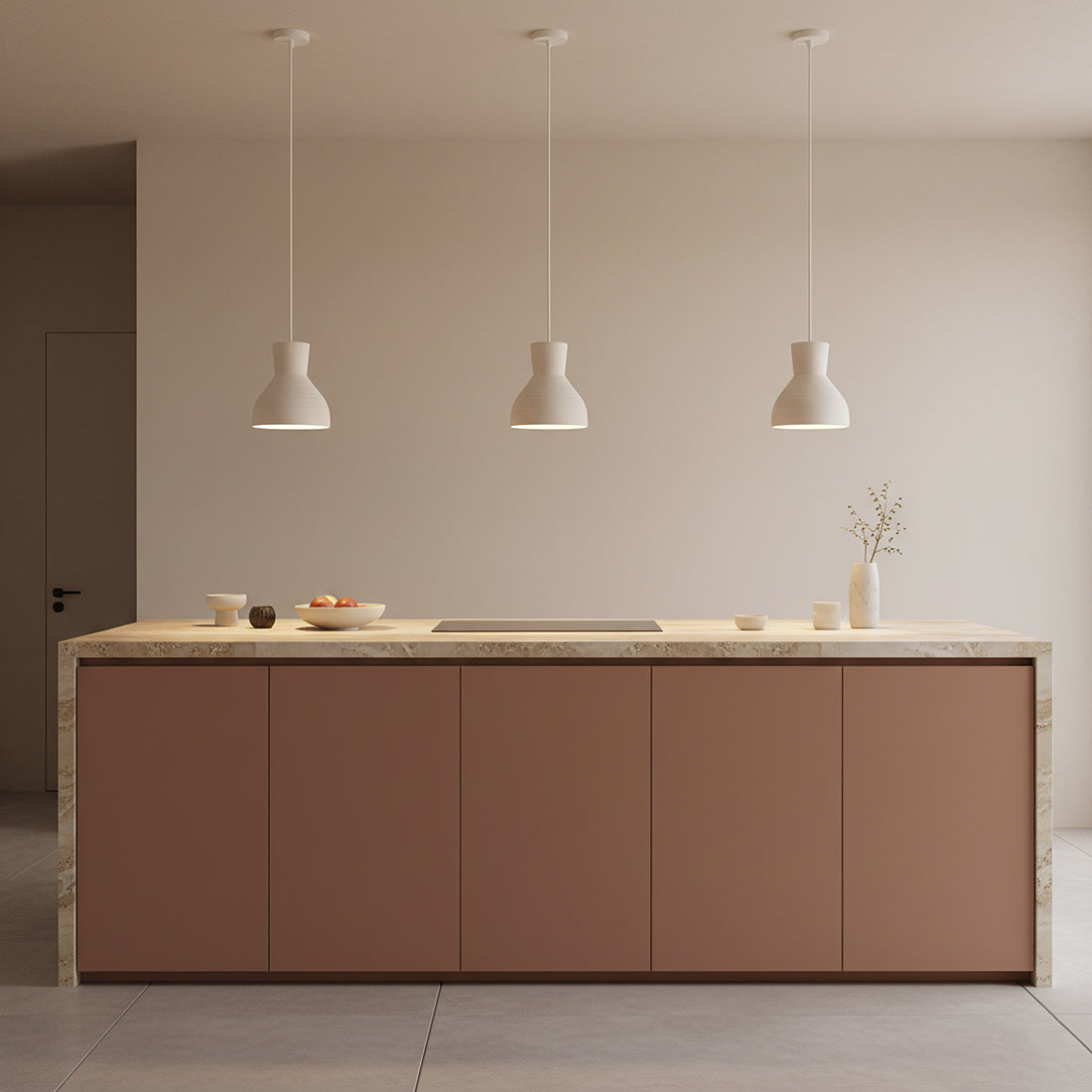 Three Kayu Living Chalk pendant lamps in natural matte finish hanging over a modern kitchen island.