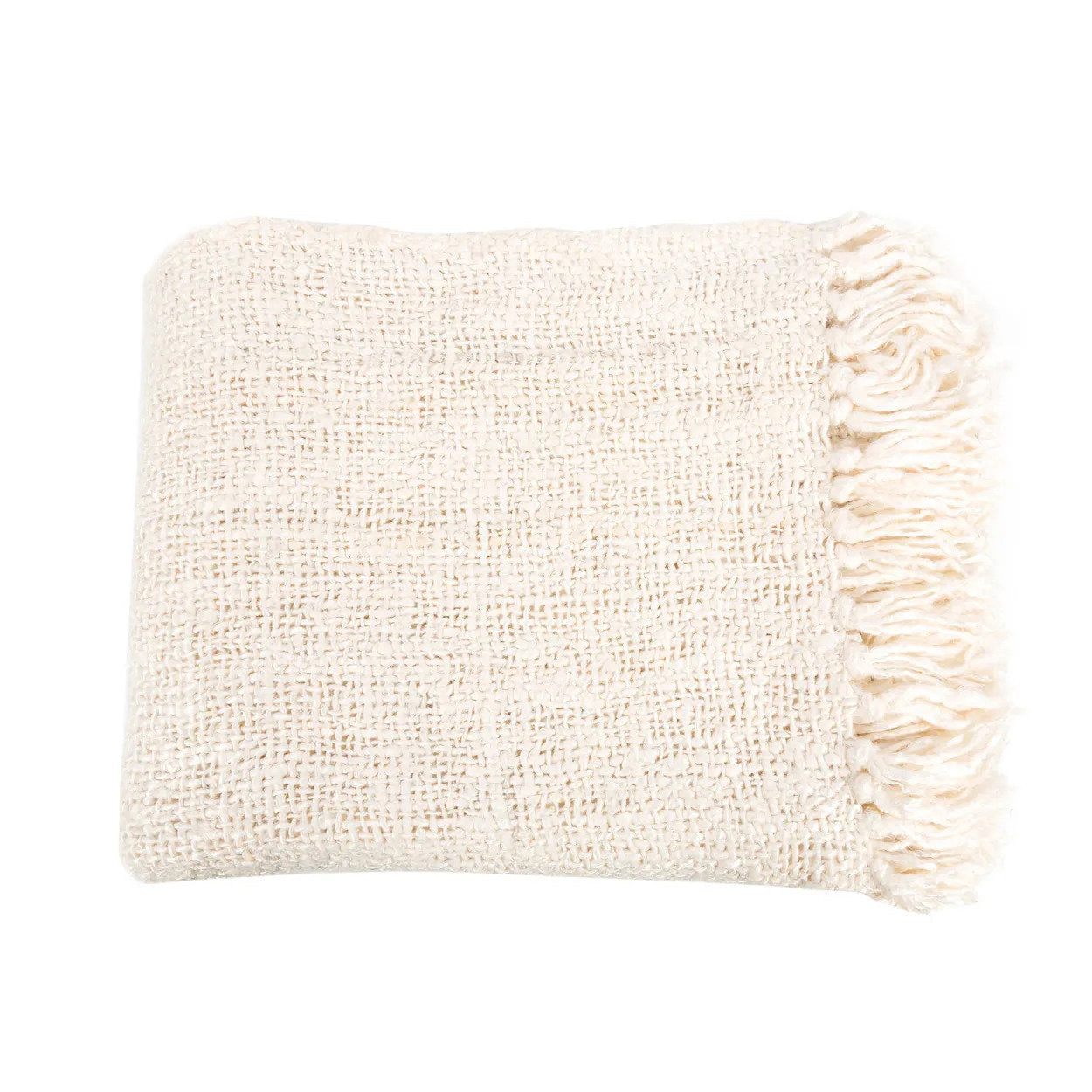 Kayu Living cream hand-woven cotton throw blanket with a waffled texture and decorative fringe edges.