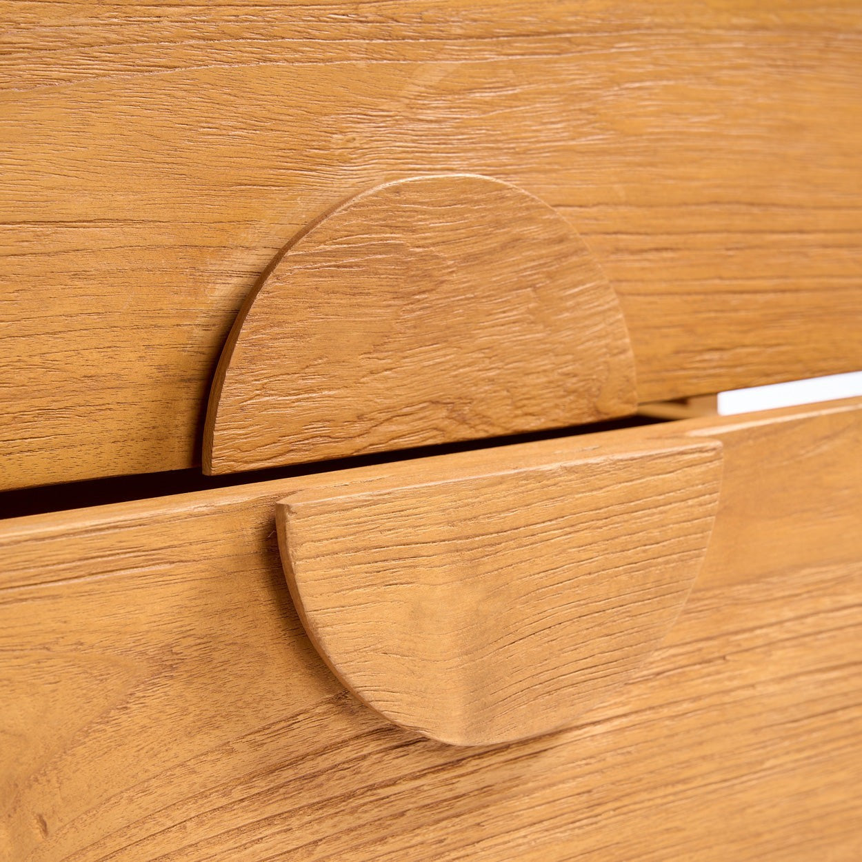 Close-up of the Kayu Living Eclipse nightstand featuring solid teak wood grain and a sculpted circular drawer handle.