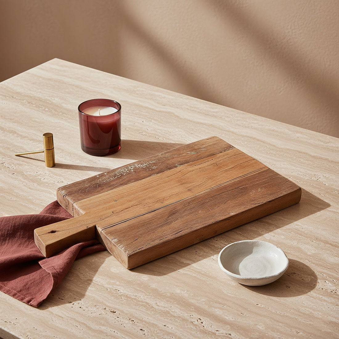 Kayu Living Farmwood 40 cm reclaimed wood serving board with natural grain and handle on a stone table.