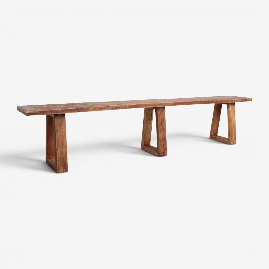 Kayu Living Farmwood dining bench in recycled wood with a natural grain finish and three sturdy trapezoid legs.