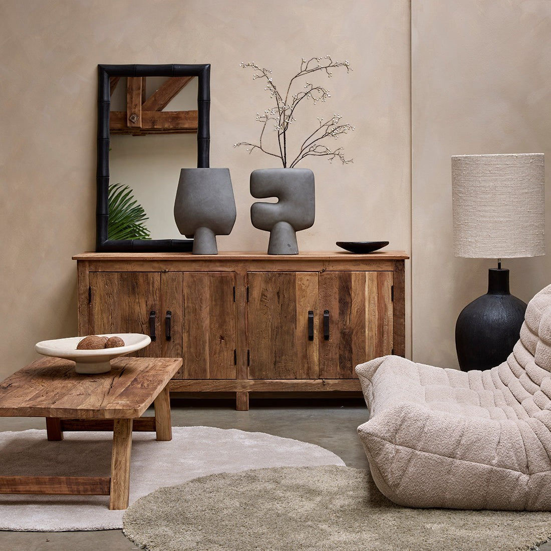 Kayu Living Farmwood sideboard made of recycled wood with four doors, styled in a living room with decor and furniture.