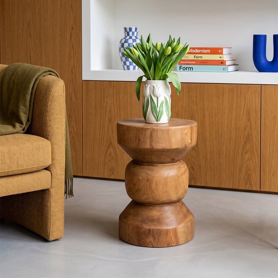 Kayu Living Forma Ritari solid teak side table with a stacked geometric design, styled in a modern living room.