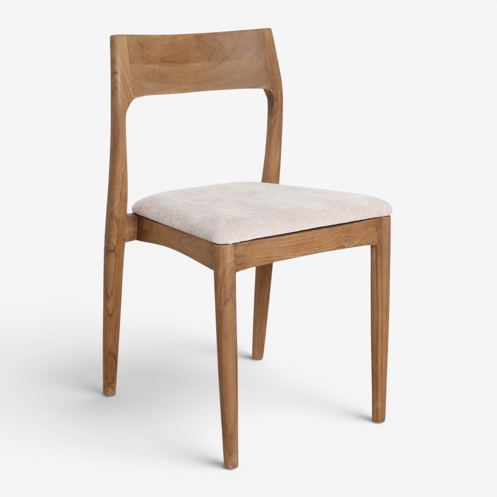 Kayu Living Freya dining chair in solid teak wood with a soft cream upholstered seat against a white background.
