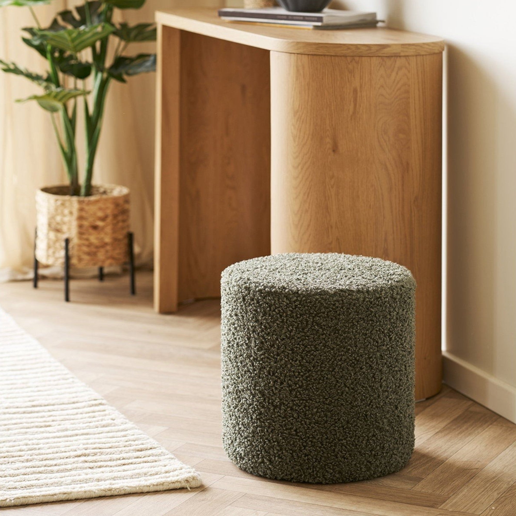 Kayu Living green teddy pouf with plush polyester cover and wooden core, perfect for living rooms or bedrooms.