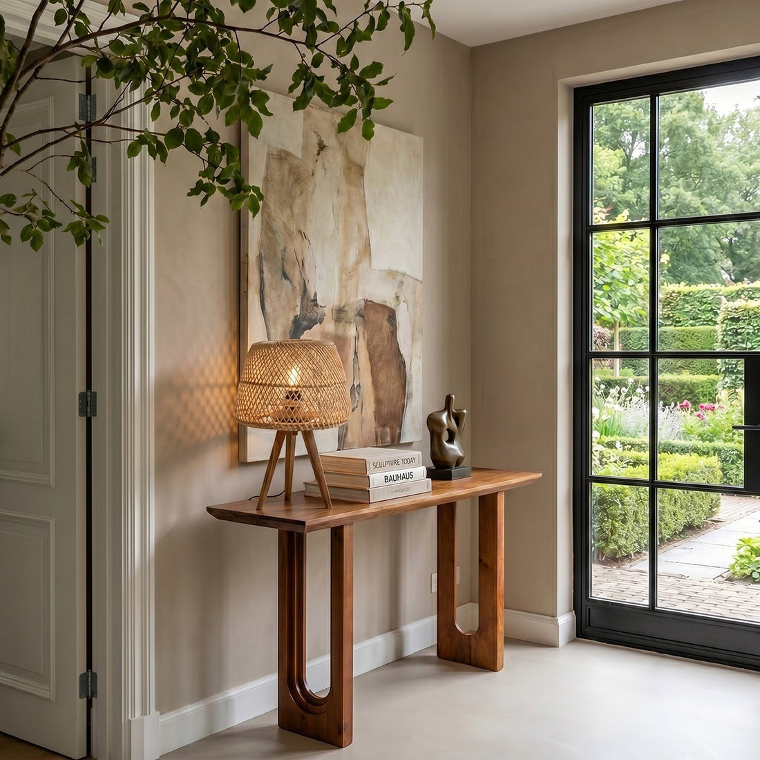 Kayu Living solid mango wood console table with chamfered edges in a stylish hallway setting with decor.