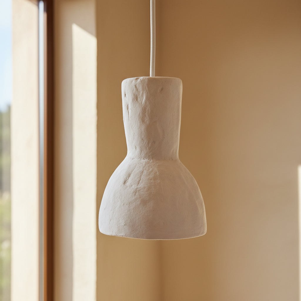 Kayu Living Moro chalk pendant lamp in a sand-colored matte Ecomix finish with a textured, artisanal stone-like look.