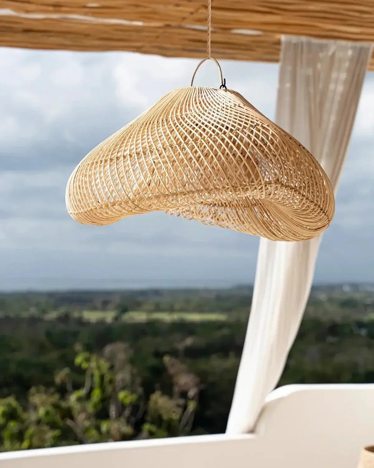 Kayu Living natural rattan pendant lamp with a cloud-shaped design, perfect for boho decor.