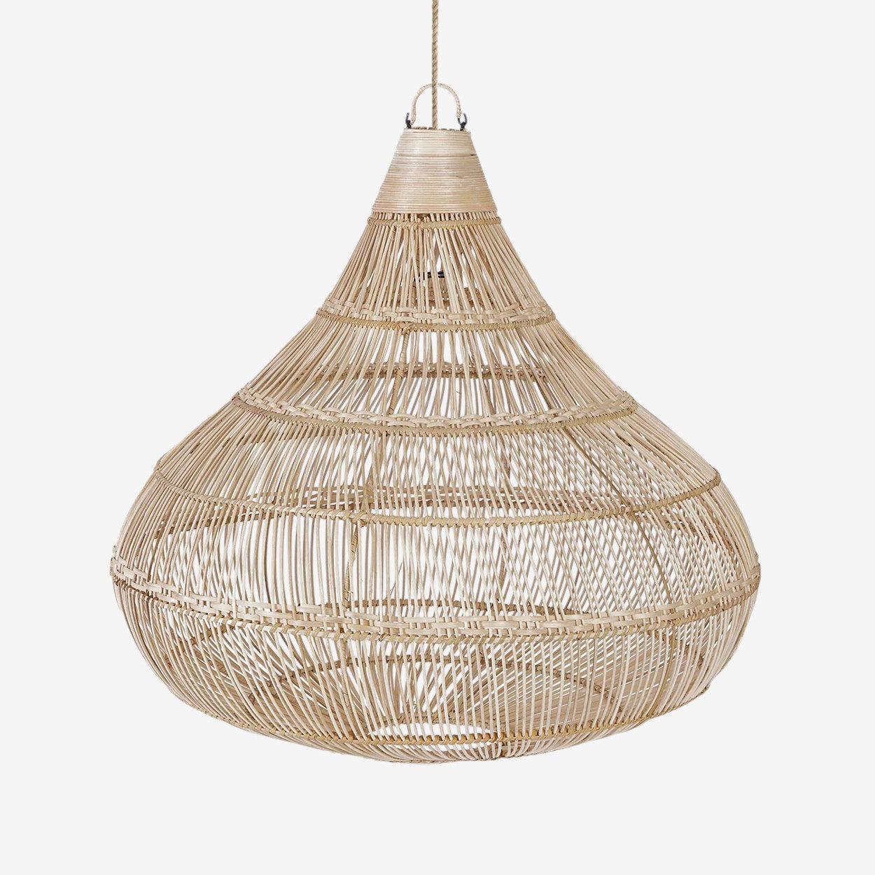 Kayu Living natural teardrop pendant lamp made of woven rattan, creating ambient light and shadows.