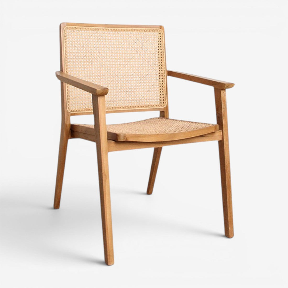 Kayu Living Nova teak dining chair with armrests and hand-woven rattan seat and back in a natural wood finish.
