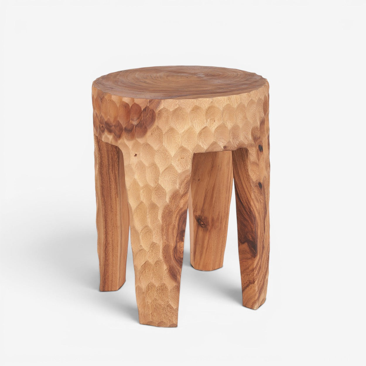 Kayu Living Paramo stool handcrafted from natural suar wood with a textured finish and three sturdy legs.