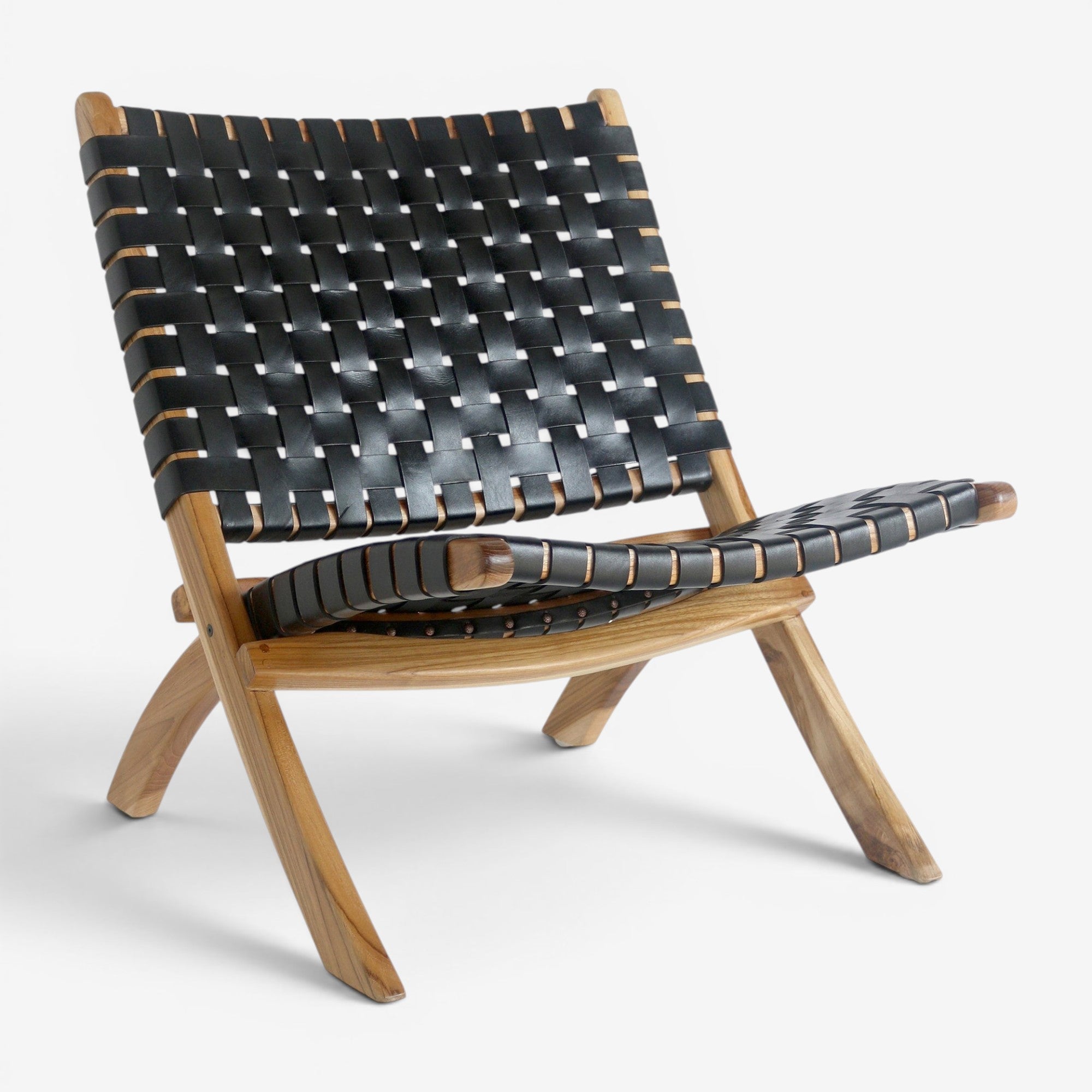 Kayu Living Perugia folding chair with black woven leather seat and natural teak wood frame on white background