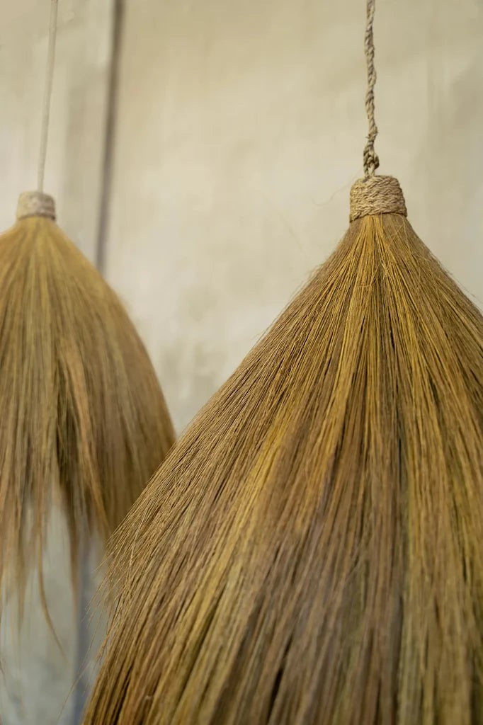 Kayu Living Rayung pendant lamp, handcrafted from natural rayung grass with a flowing silhouette and organic texture.