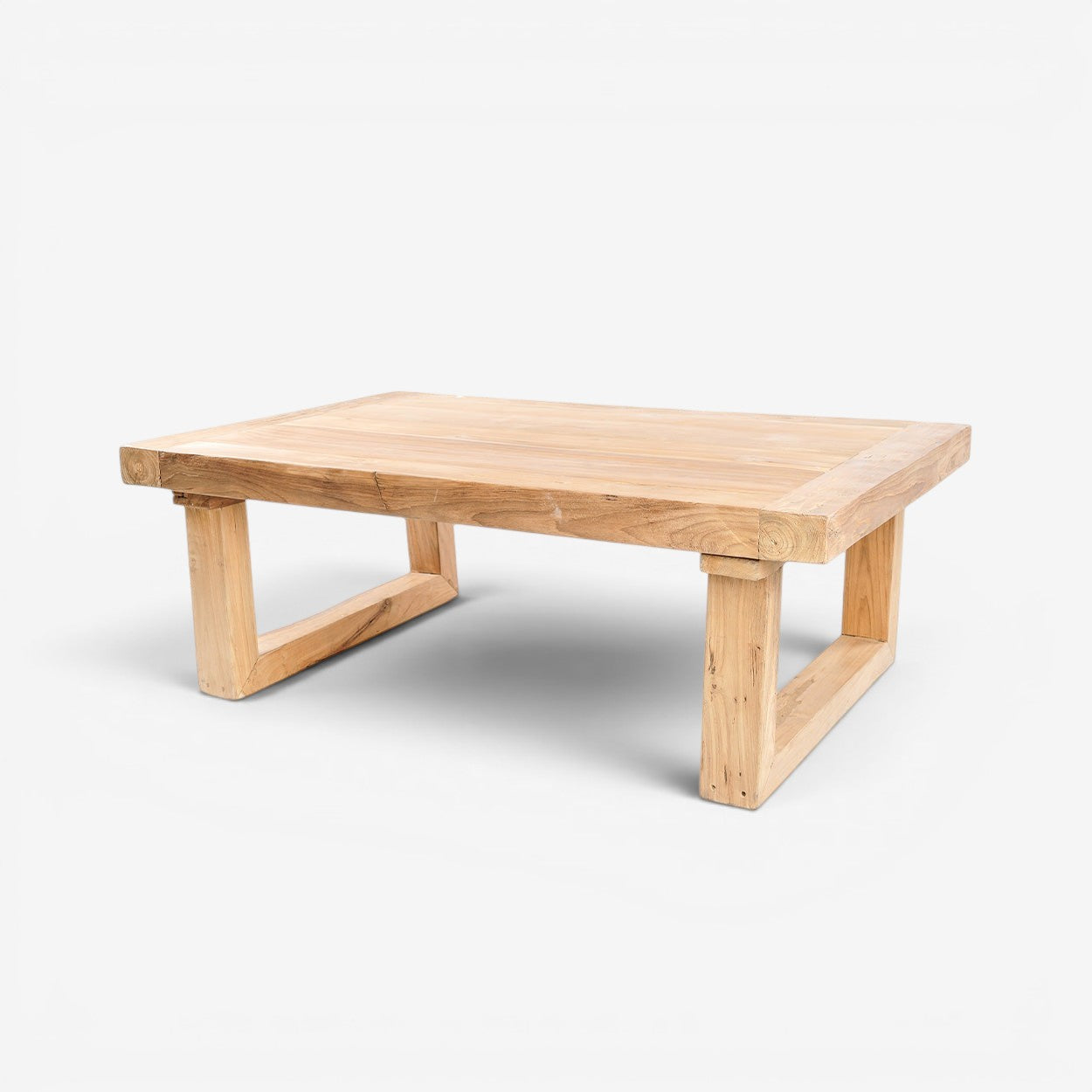 Kayu Living reclaimed teak coffee table with a natural wood finish and sturdy, minimalist block legs.