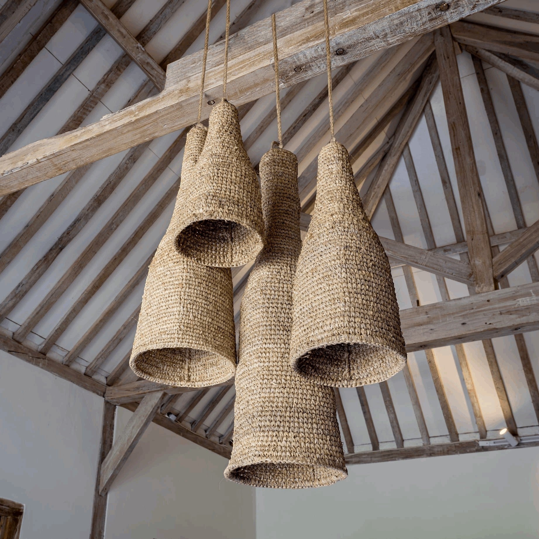 Kayu Living natural sisal pendant lampshade, wasp house design, beige woven texture, conical shape, rustic elegance.