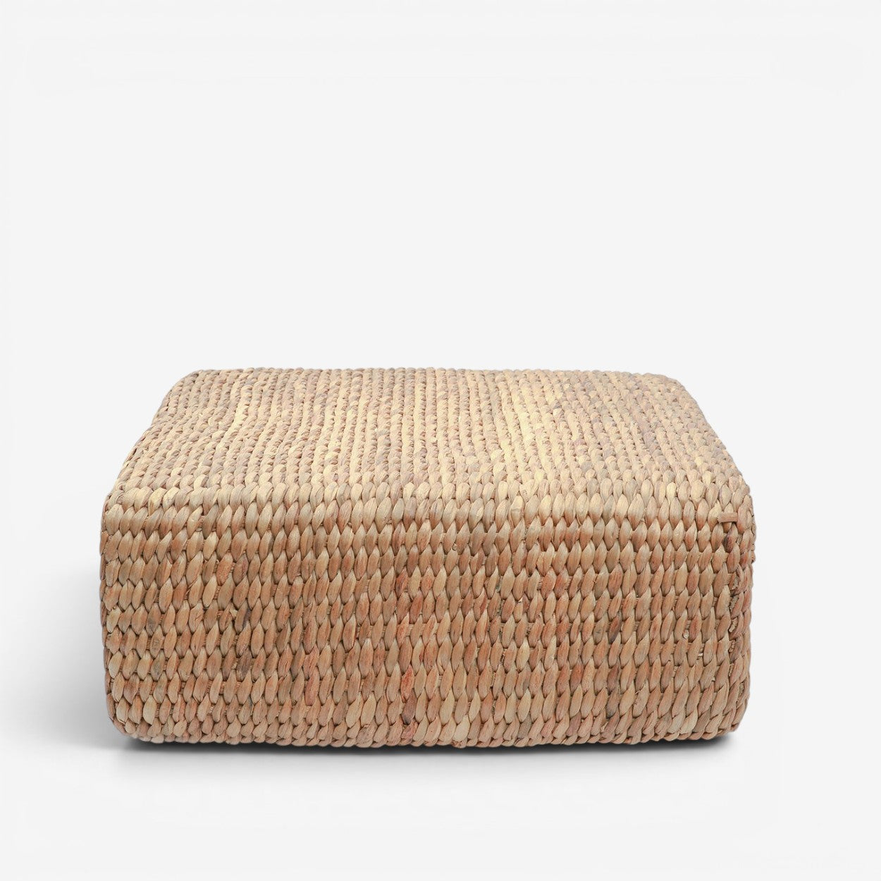 Kayu Living square water-hyacinth pouf in natural tan, featuring a durable woven texture for indoor or outdoor use.