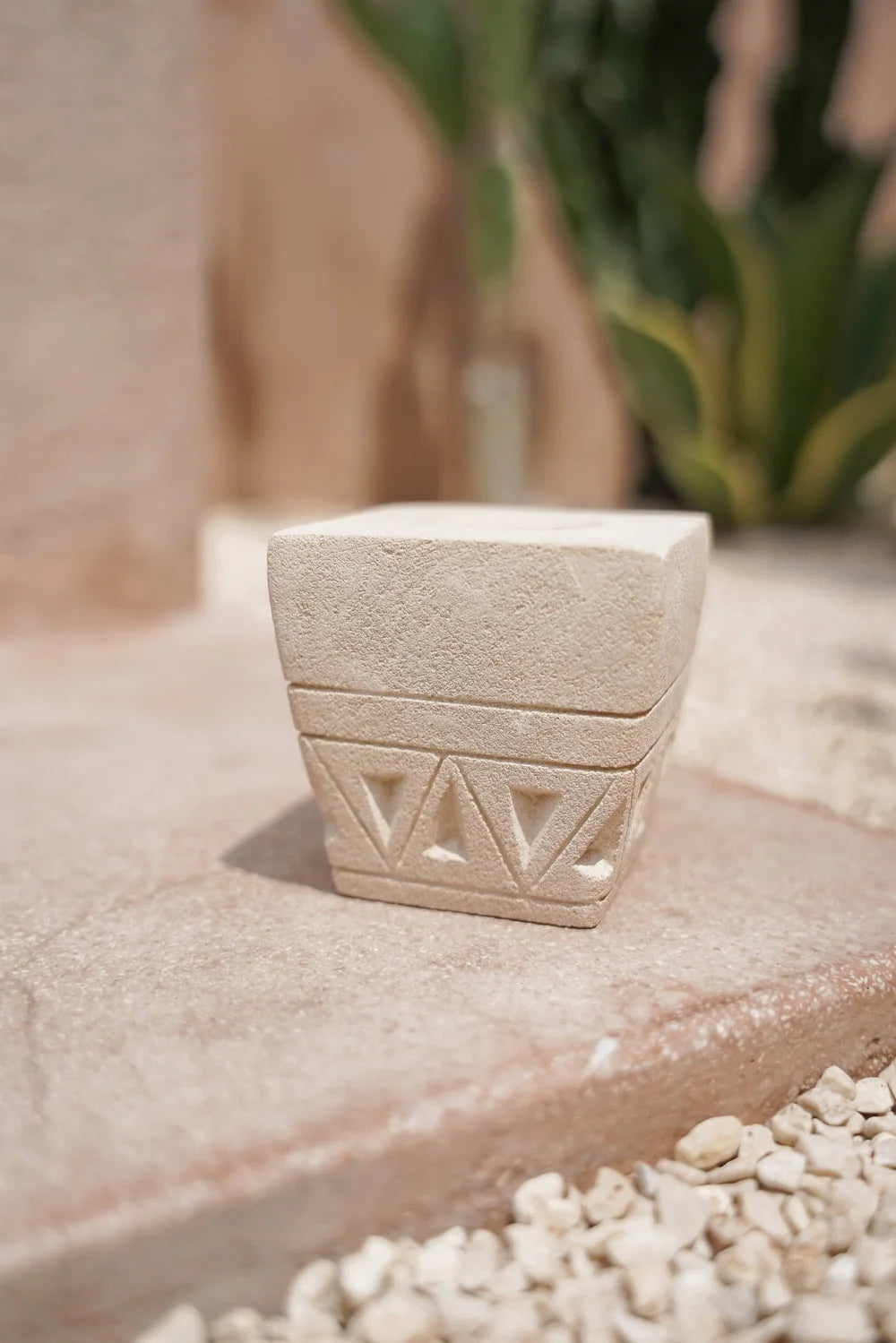 Kayu Living handmade beige stone candle holder with geometric engravings, featuring a square tealight recess.