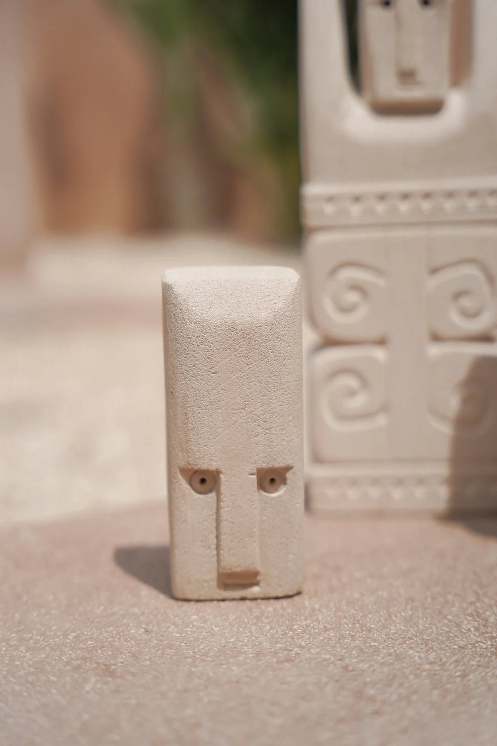 Kayu Living handcrafted Balinese stone figurine with a natural finish and minimalist face design