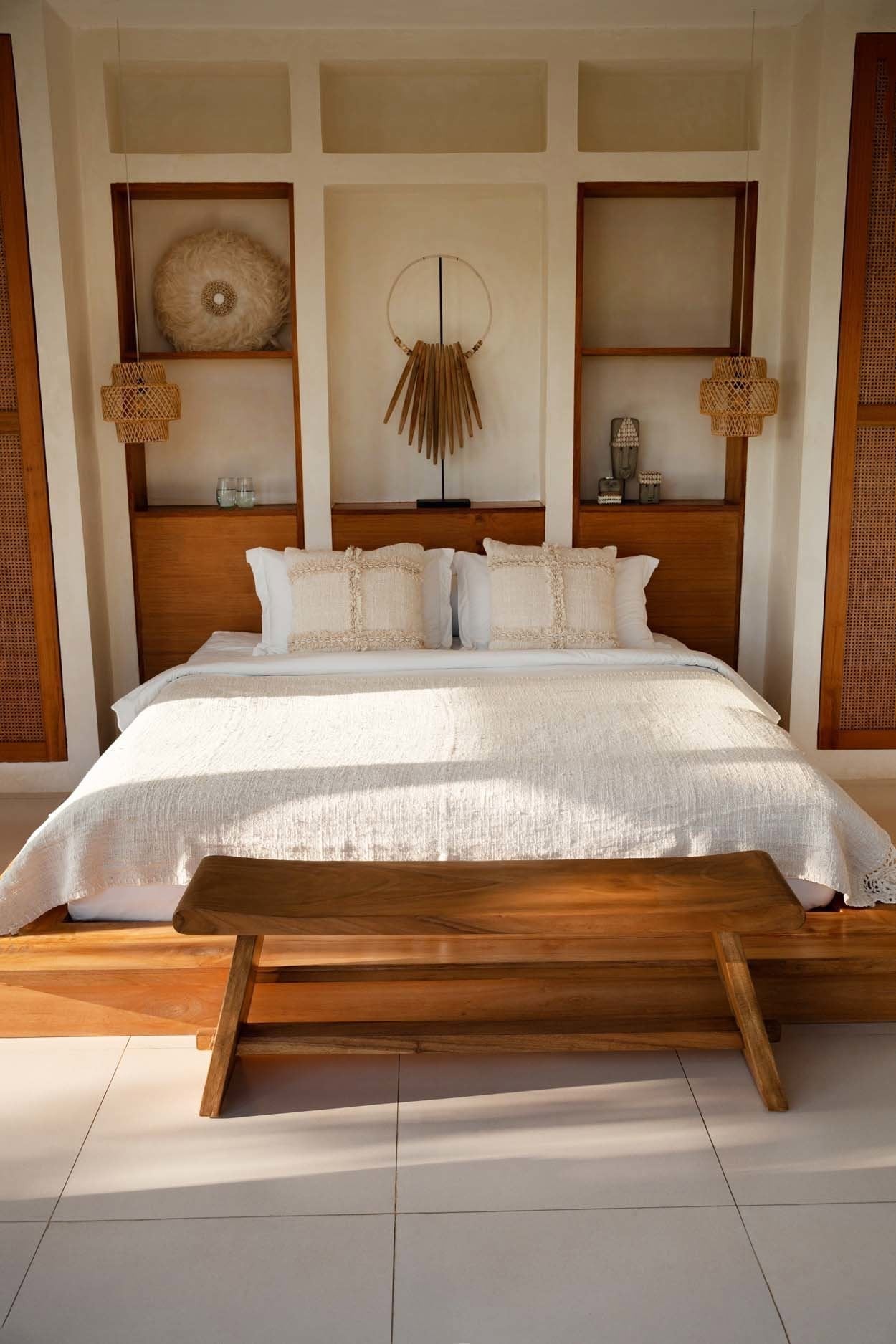 Kayu Living 120 cm handmade solid Suar wood bench with natural grain in a minimalist bedroom setting.