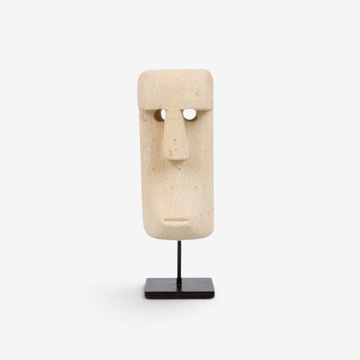 Kayu Living hand-carved sandstone Sumba statue on a black metal stand, featuring a unique natural stone face design.