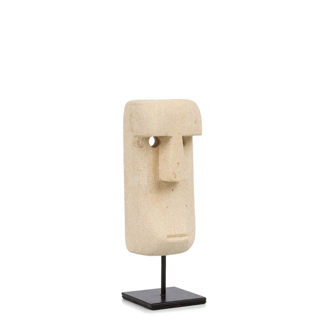 Kayu Living hand-carved sandstone Sumba statue on a black metal stand, featuring a unique tribal face design.