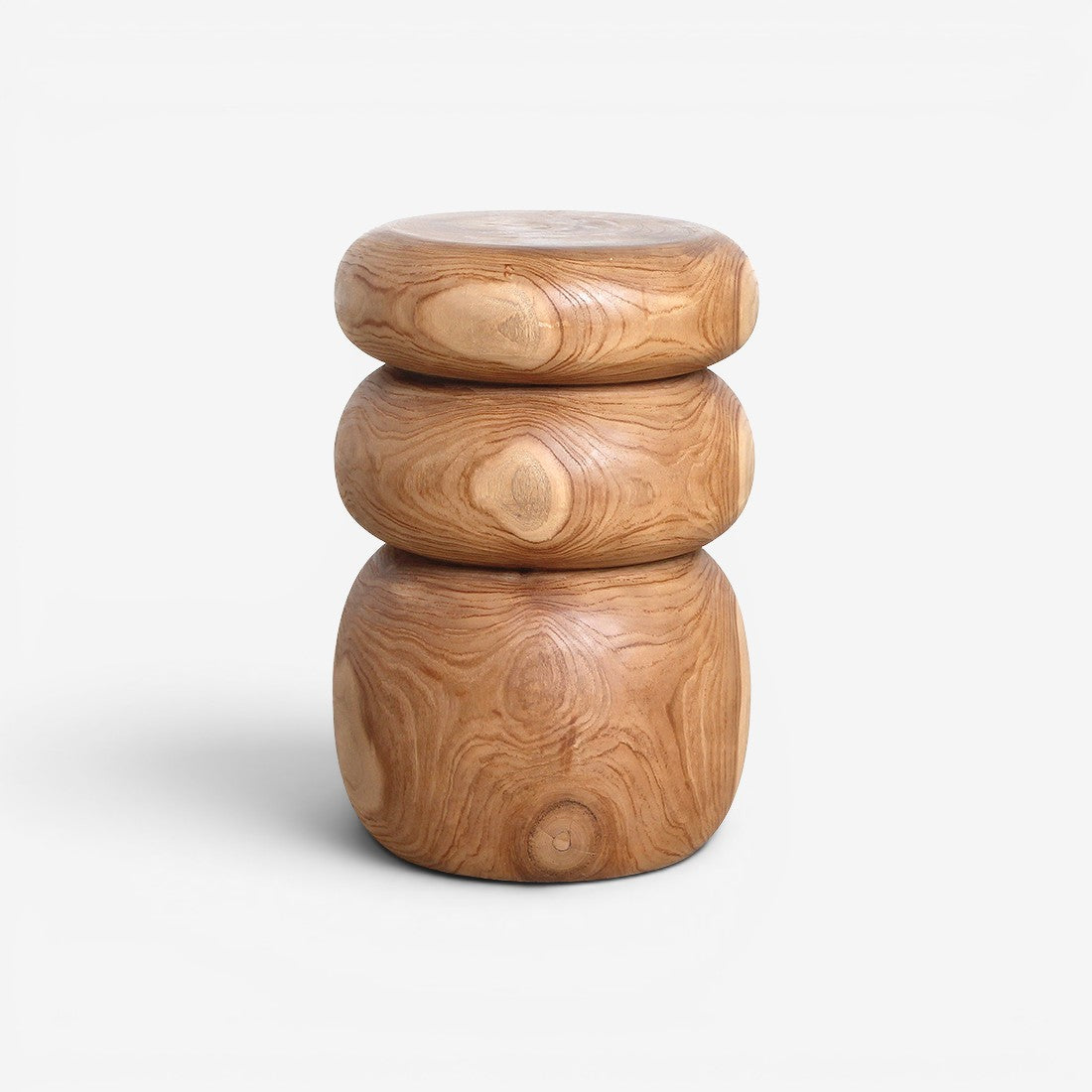Kayu Living Tao solid teak side table with rounded, stone-like stacked design and natural beige wood grain.