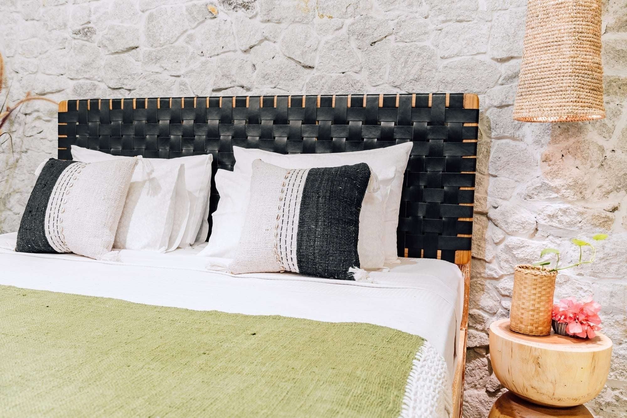 Kayu Living Umalas headboard: handcrafted teak frame with black woven leather straps. Modern artisanal design.