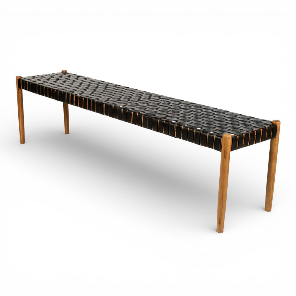Long bench with woven top and wooden legs on a white background