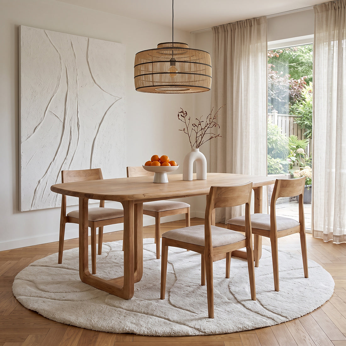 Set of two Raw Materials Freya teak dining chairs in cream with sleek, modern design and wooden legs.