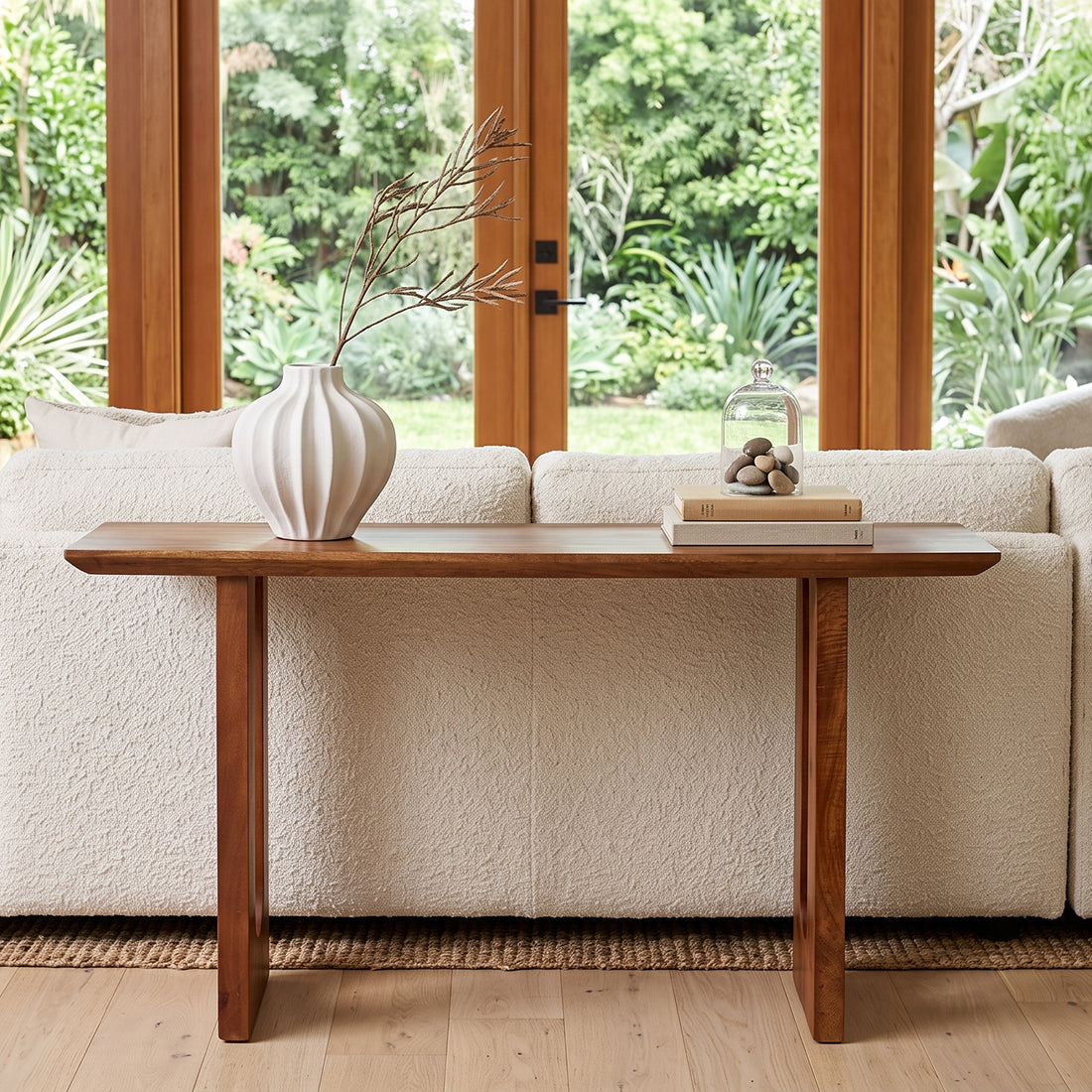 Raw Materials bullnose chamfered mango wood console table with sleek design and smooth finish, showcasing natural wood grain.