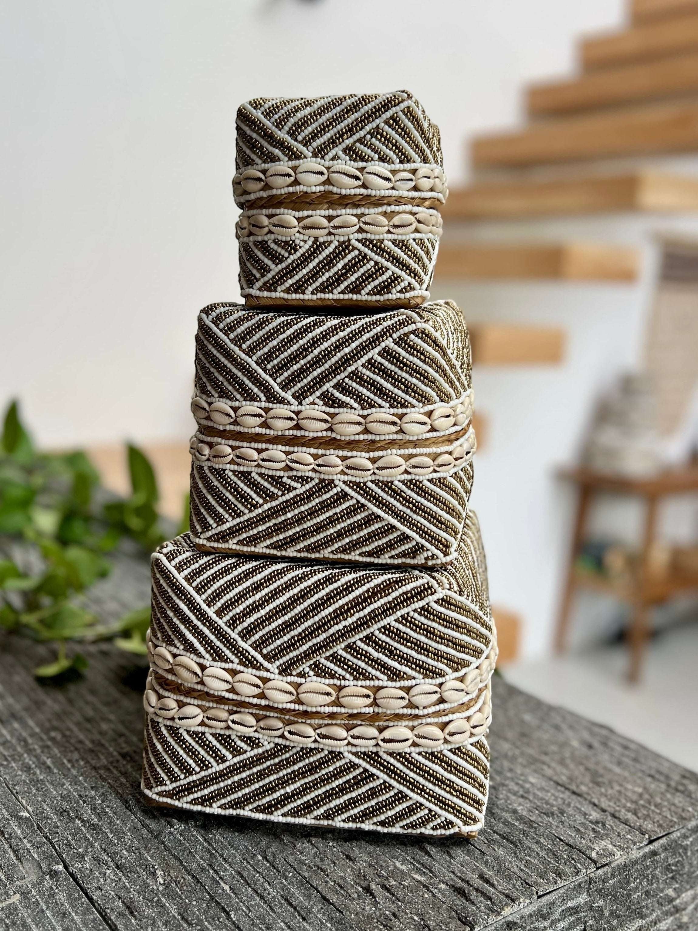 Kayu Living handmade beaded boxes in gold and white with shell accents. Perfect for home decor.