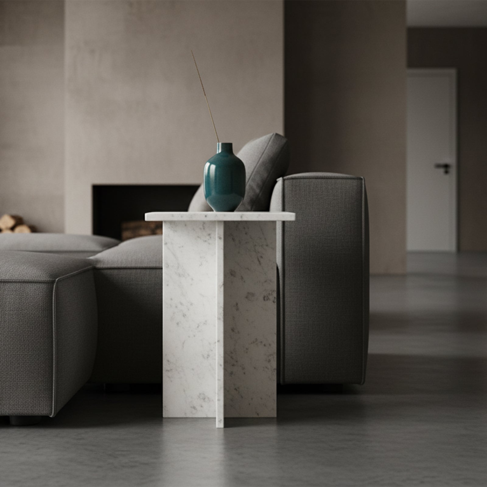 Kayu Living Beijing white marble side table with crossed slab design next to a grey sofa in a modern living room